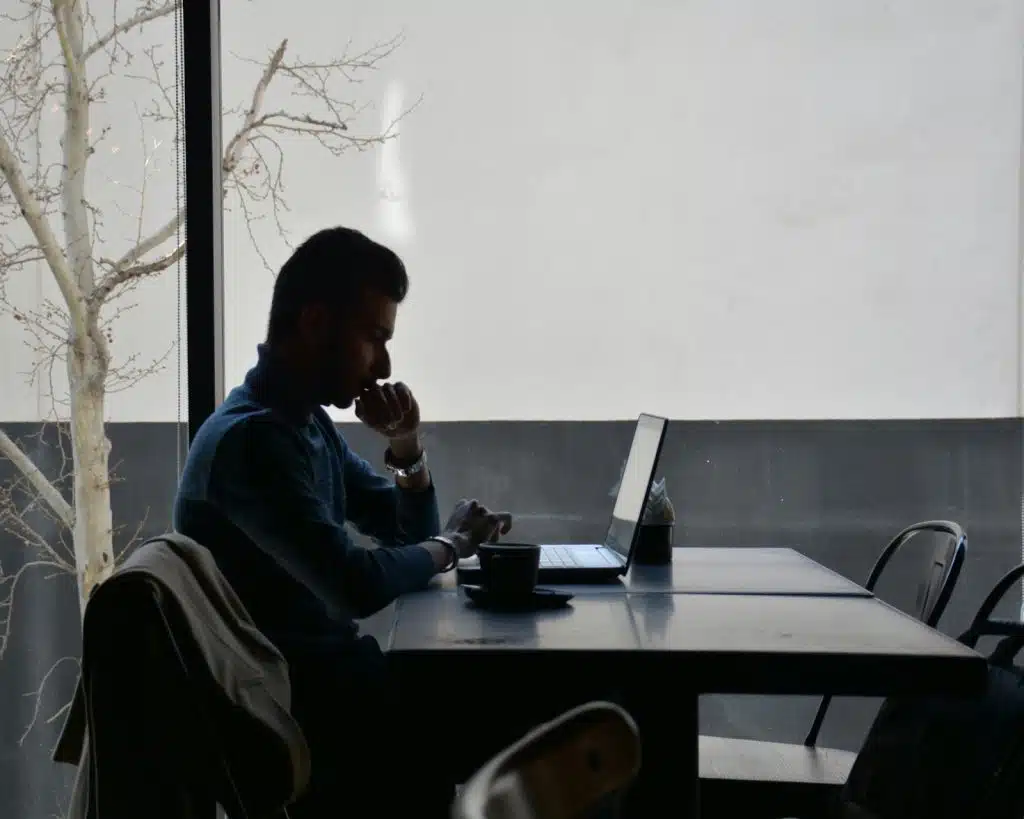 A man looking at a laptop