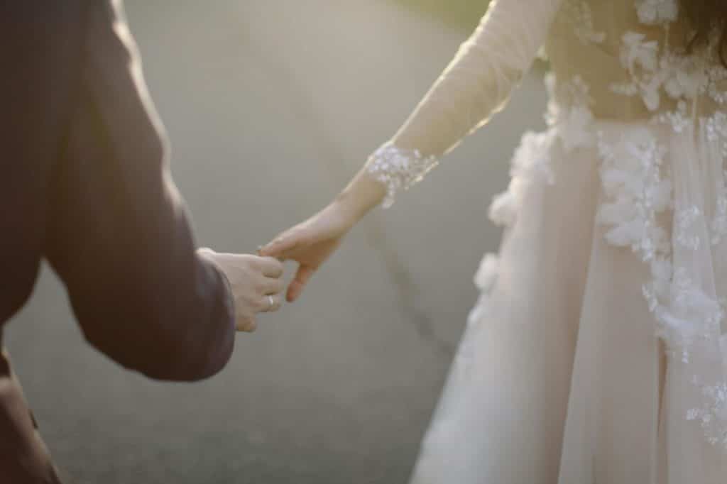 A man and woman holding hands