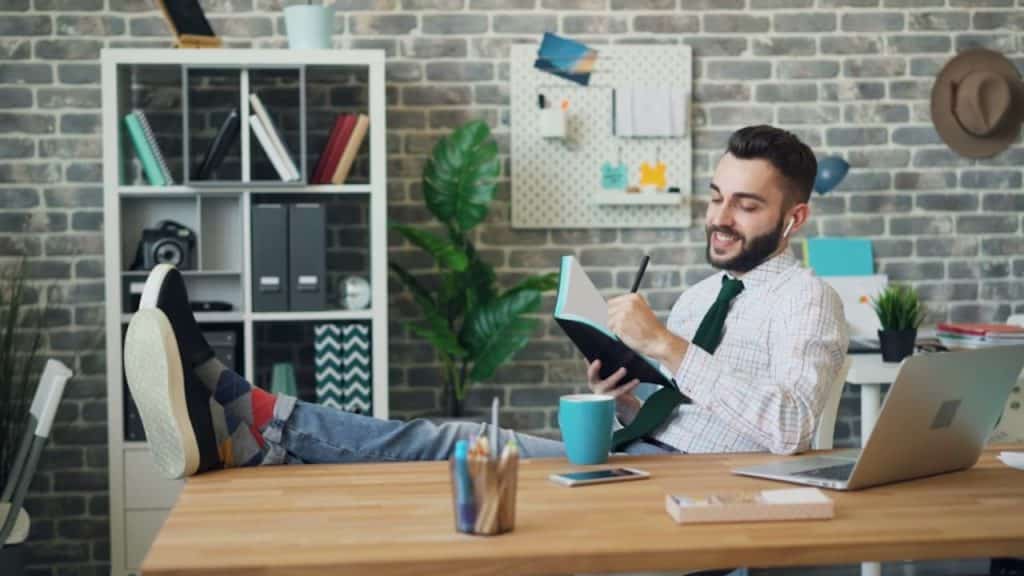Man journaling with a calm expression