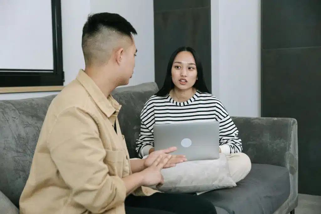 A man talking to a woman