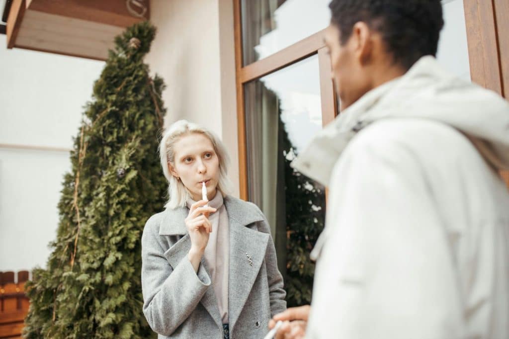 A woman looking at the man