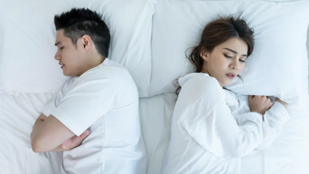 A couple not touching each other