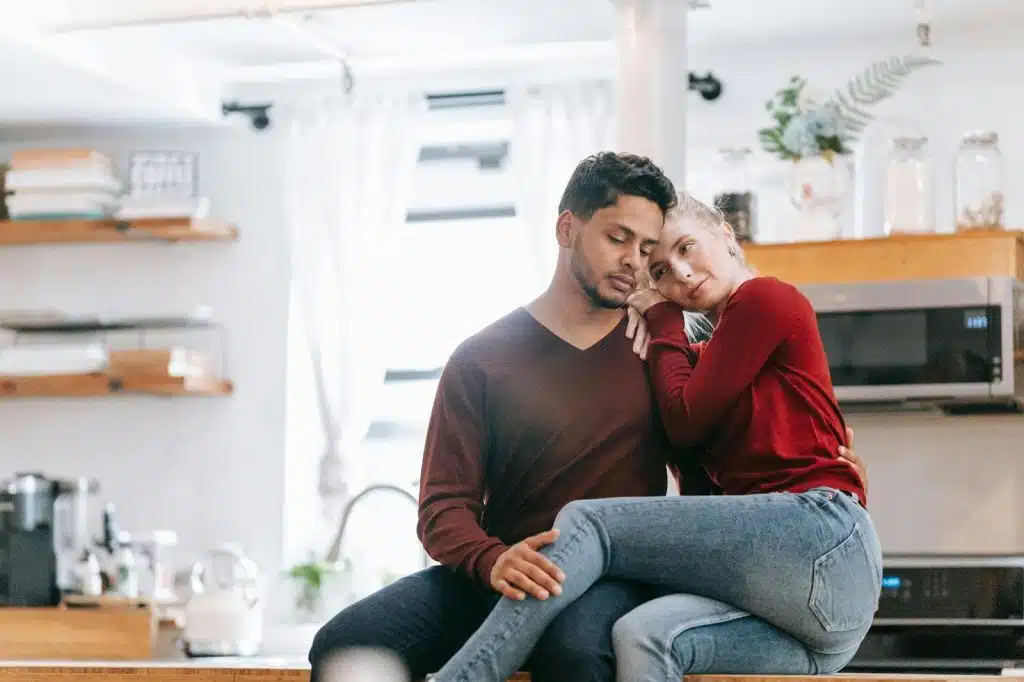 A woman leaning her head to a man