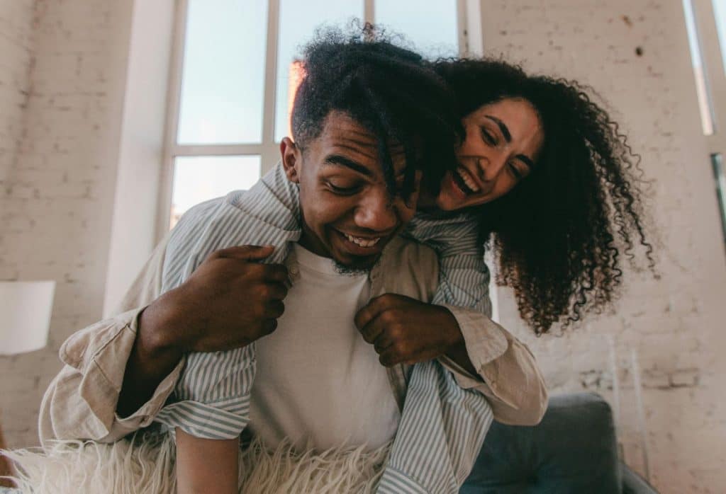 A man and woman teaming up