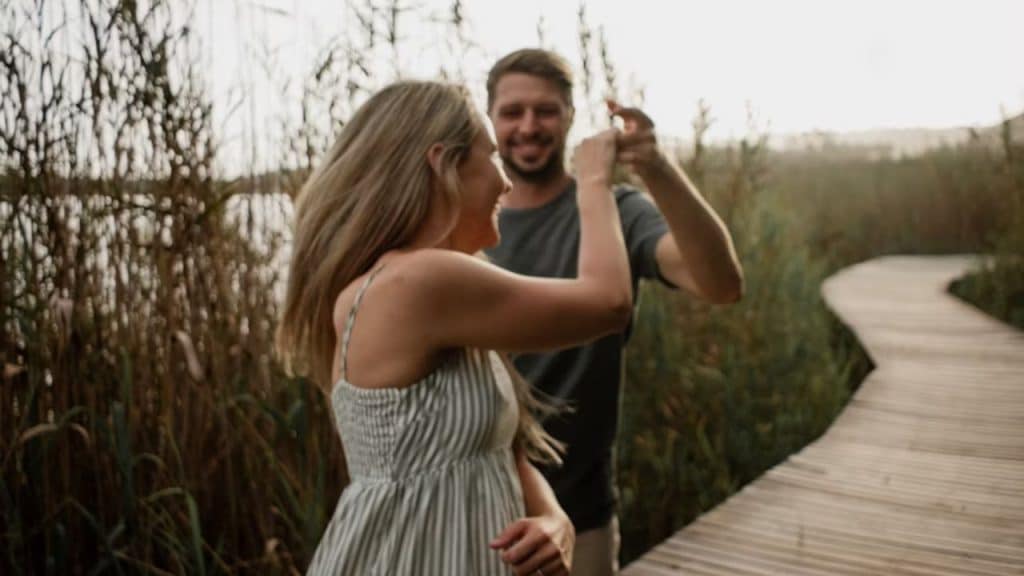 Couple laughing together on a unique date outdoors