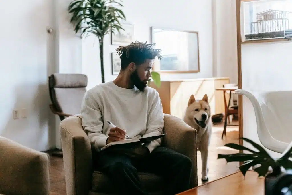 A man with his dog at home