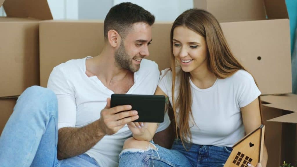 Couple reviewing plans together on a tablet