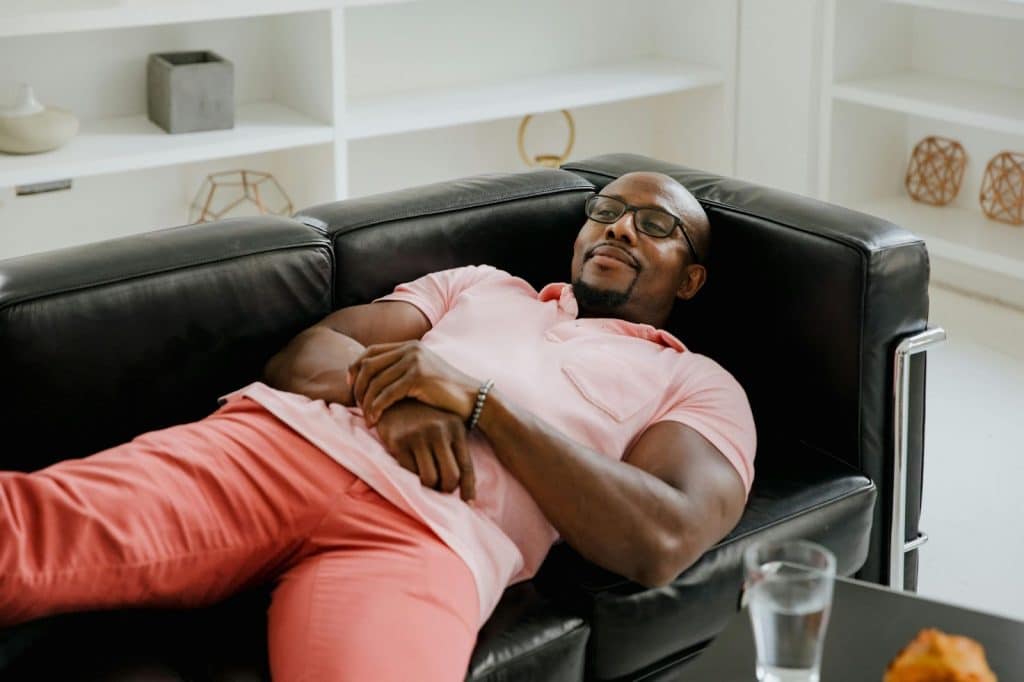 A man laying at the sofa