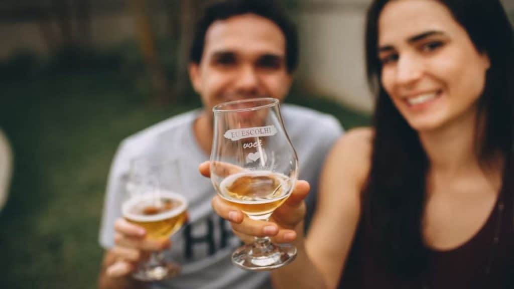 A couple celebrating with a toast outdoors