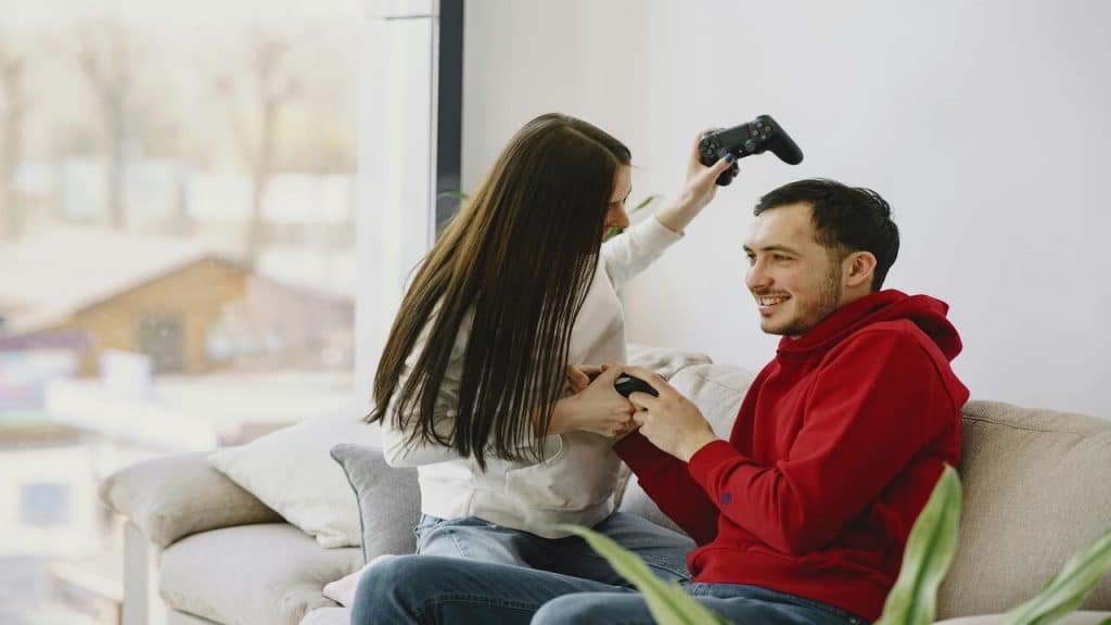 A couple playing video games together