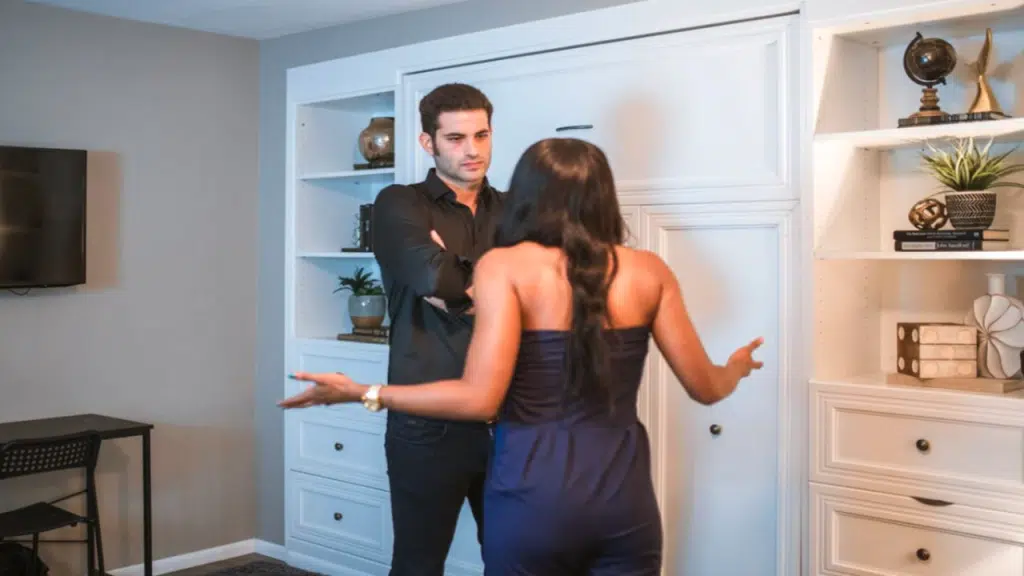 A couple fighting in the living room