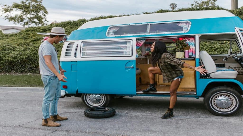 A couple arguing over a flat tire