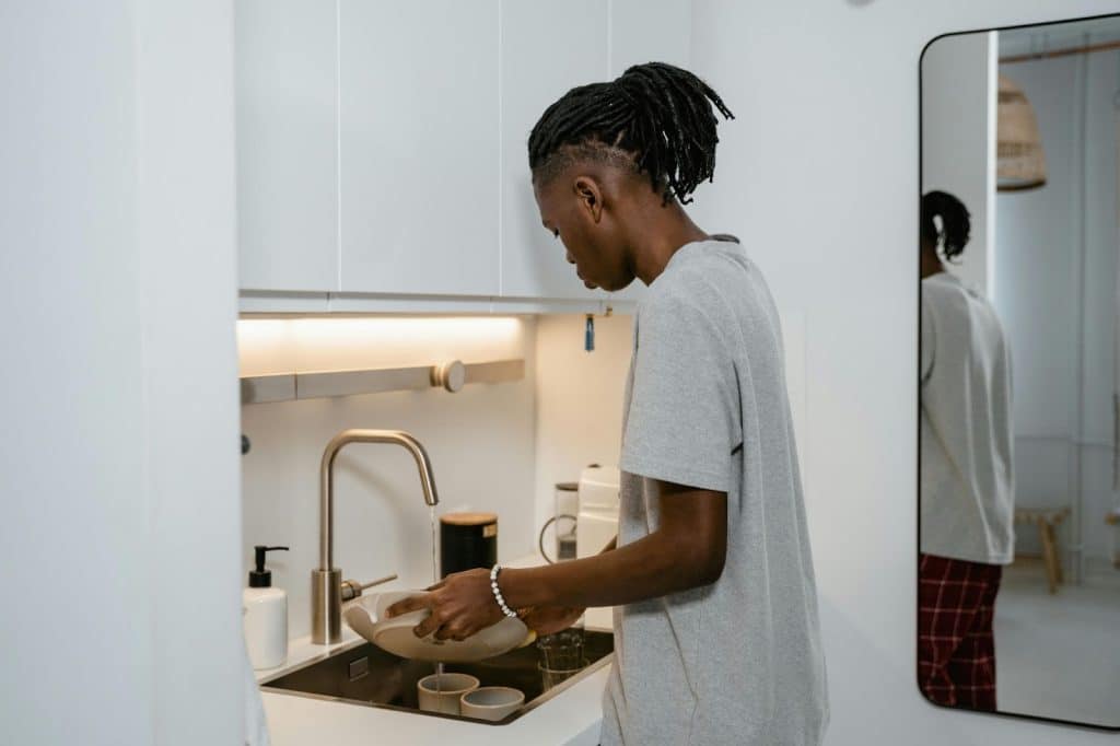 A man washing a dishes