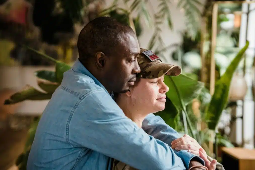 A man hugging a woman from behind