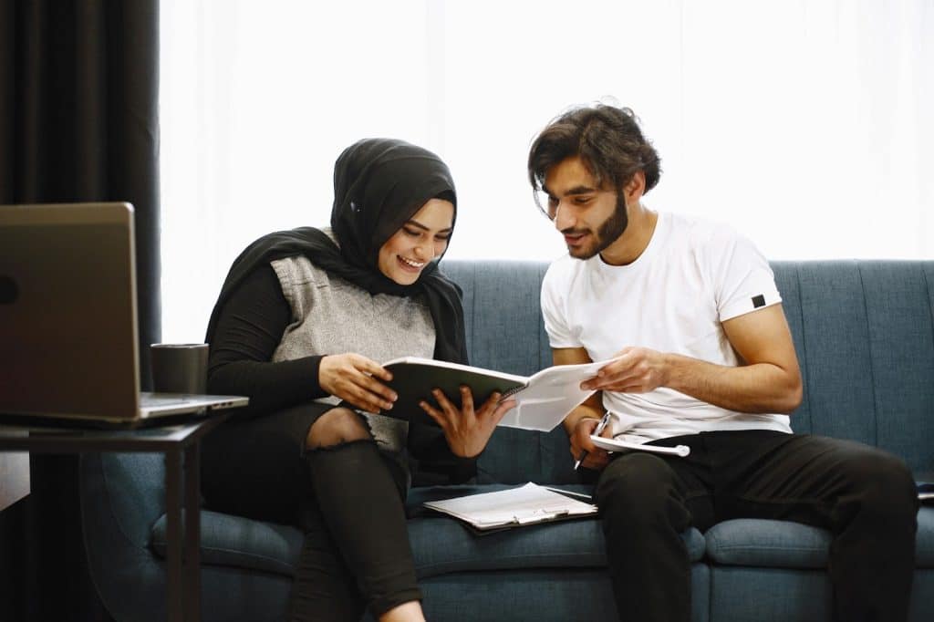 A man and woman sharing things