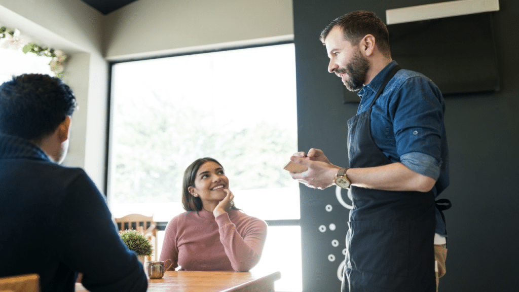 A couple talking to a server