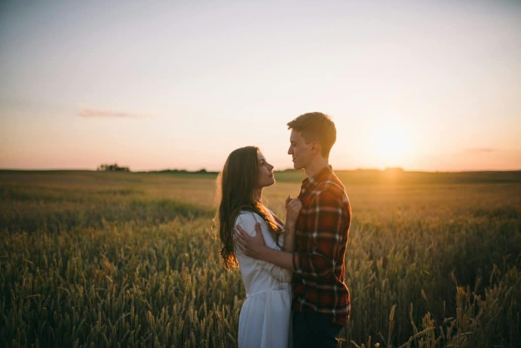 A man and woman facing each other