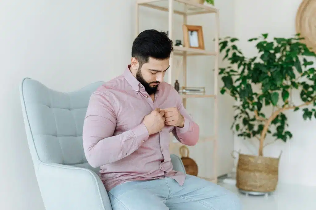 A man dressing up
