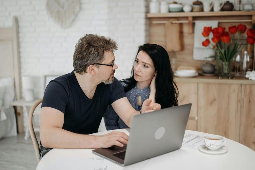 A man explaining something to a woman