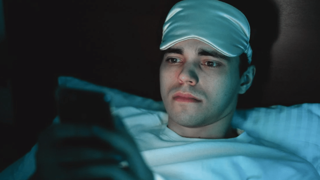 A man looking sad while texting
