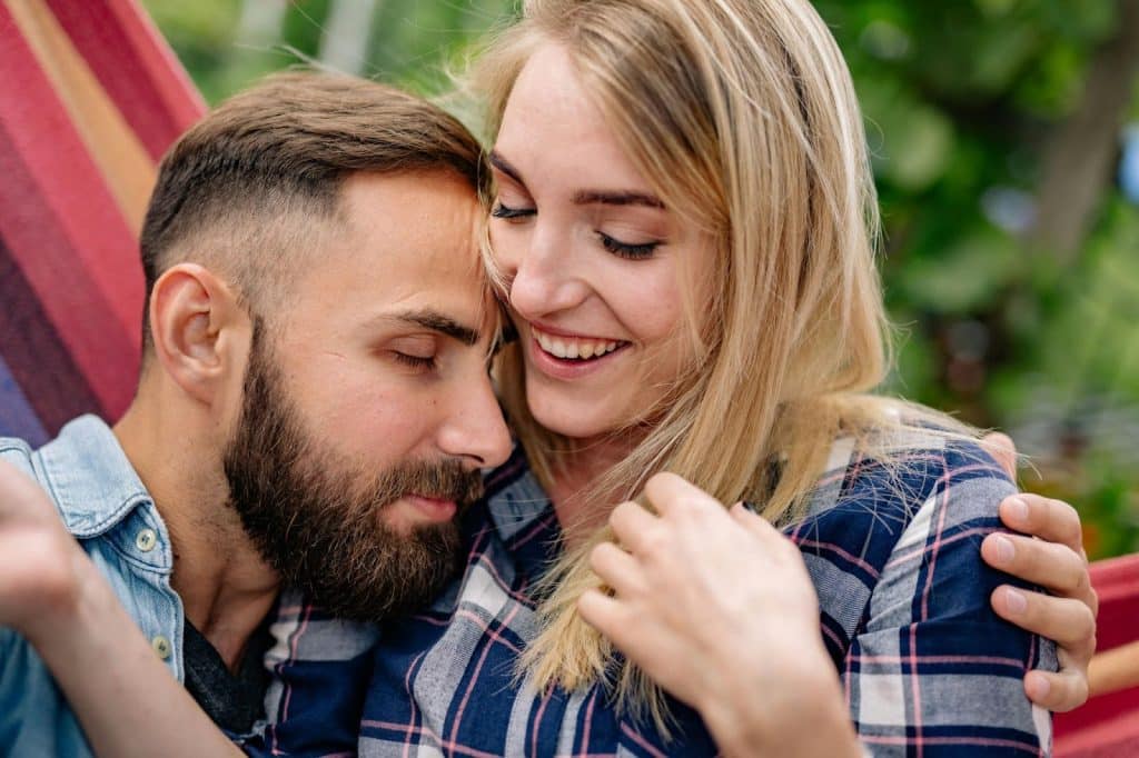 A man hugging a woman
