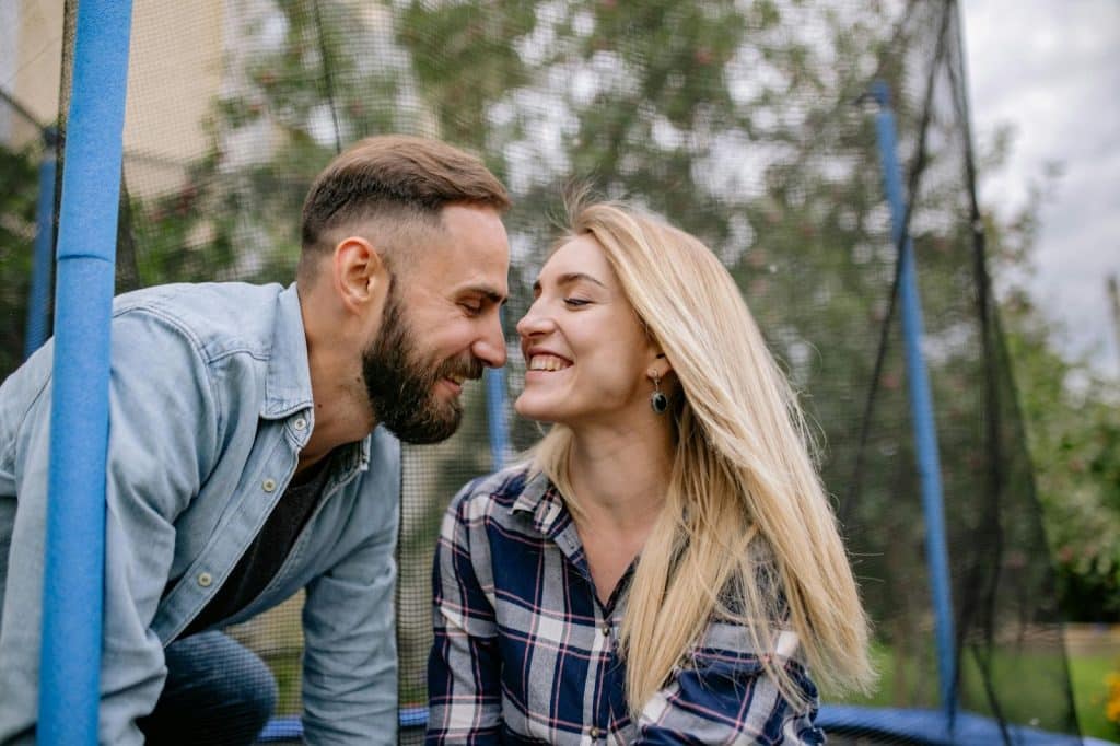 A woman showing something to a man