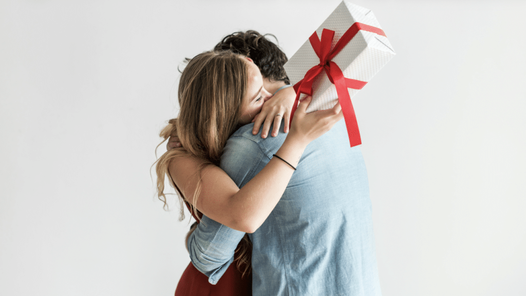 A woman receiving a gift from her husband