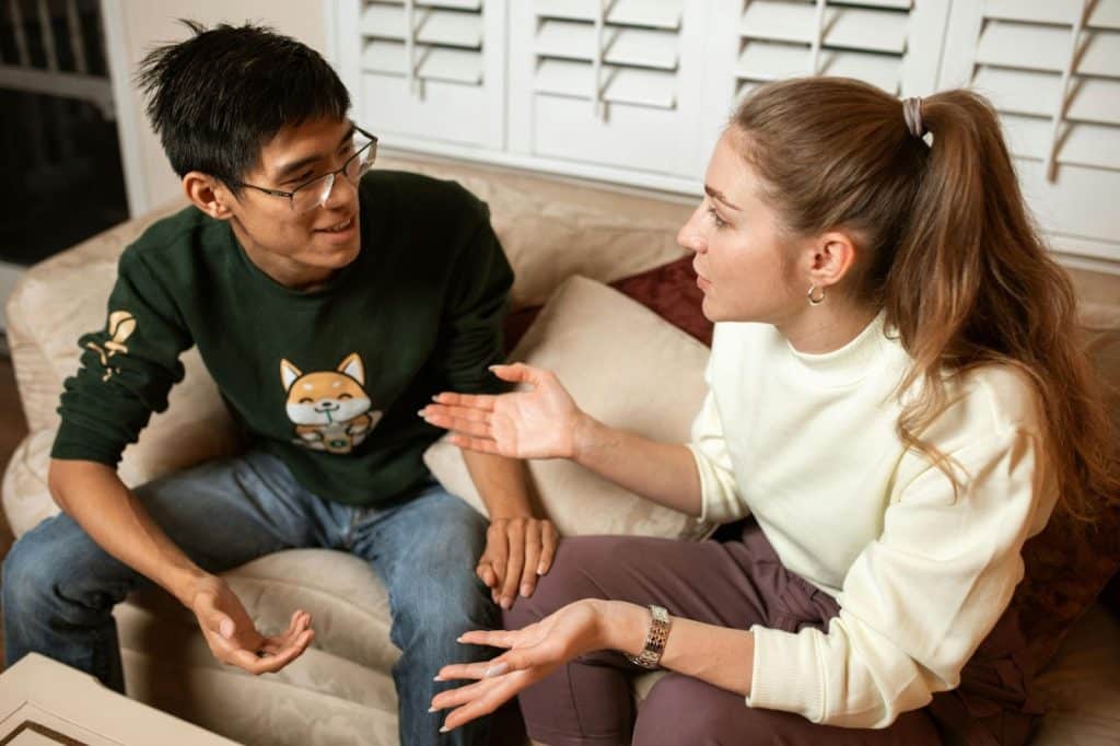 A man and woman talking