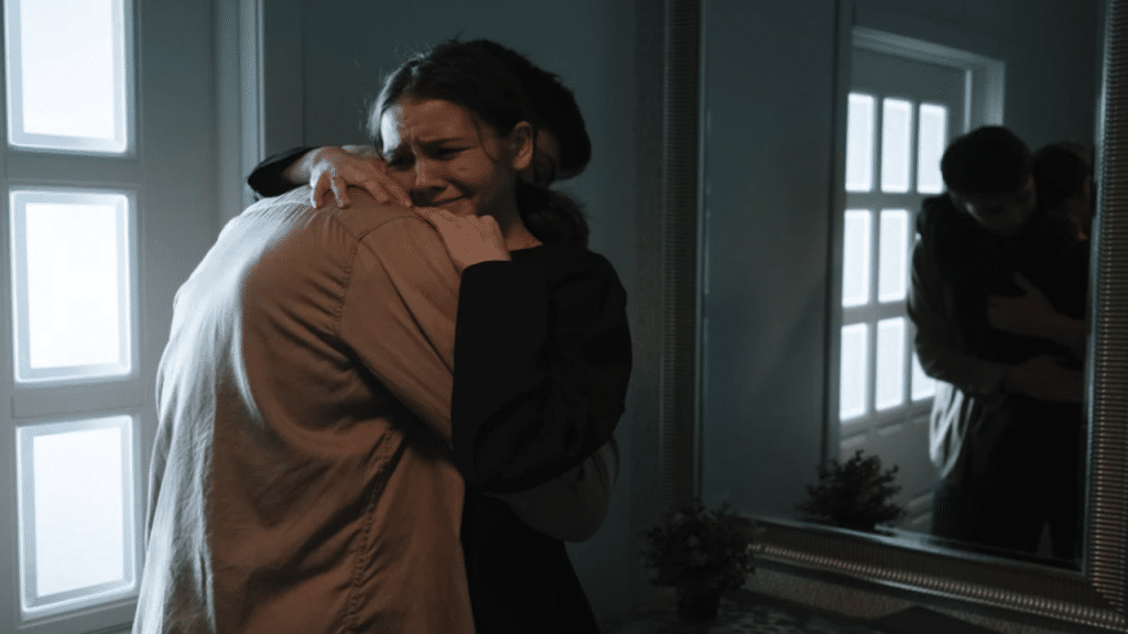 A man hugging his wife during a fight