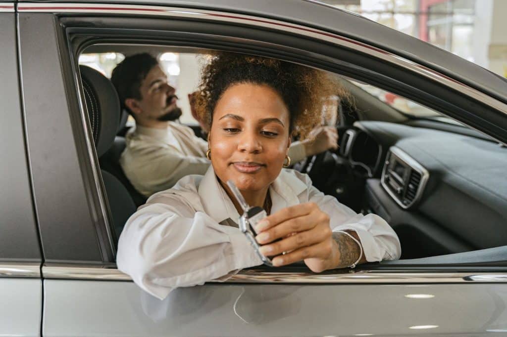 A man and woman inside the car