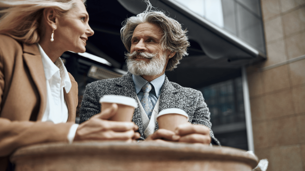 A beautiful mature couple having coffee together