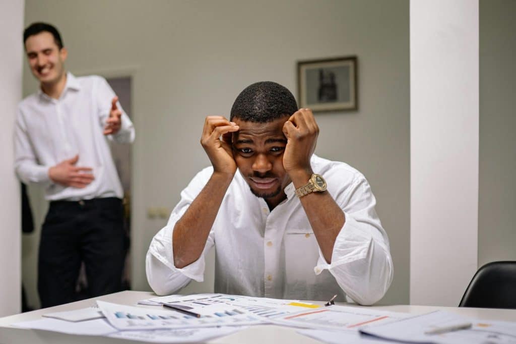 A man looking worried at work