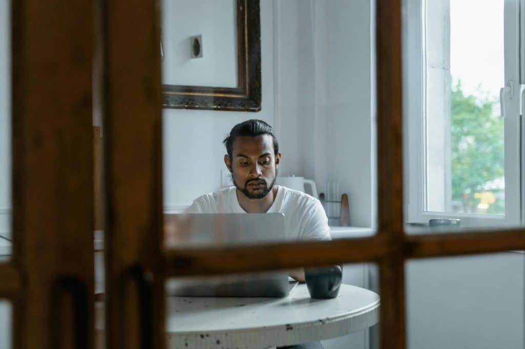 A man looking tired while working