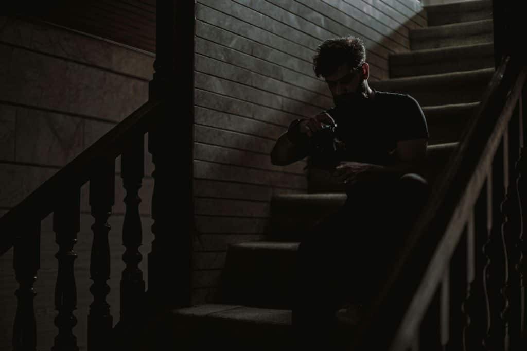 A man sitting at the staircase alone