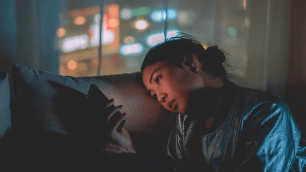 A woman waiting for her husband at night