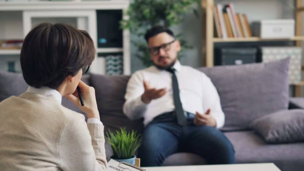 Couple in discussion with man raising his voice slightly