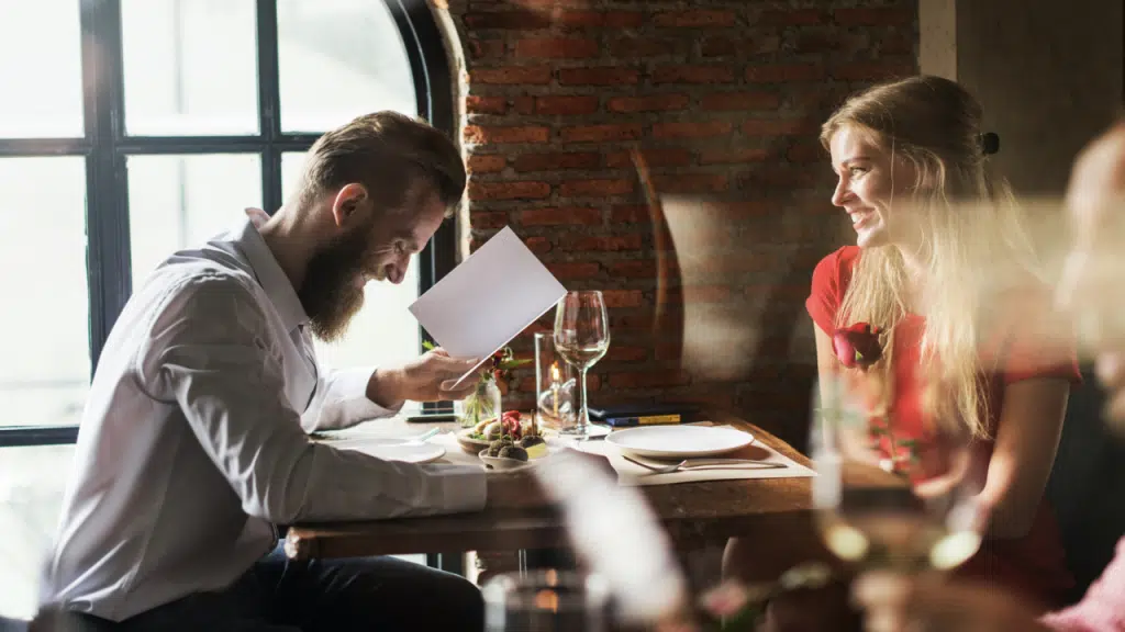 A couple looking at a menu
