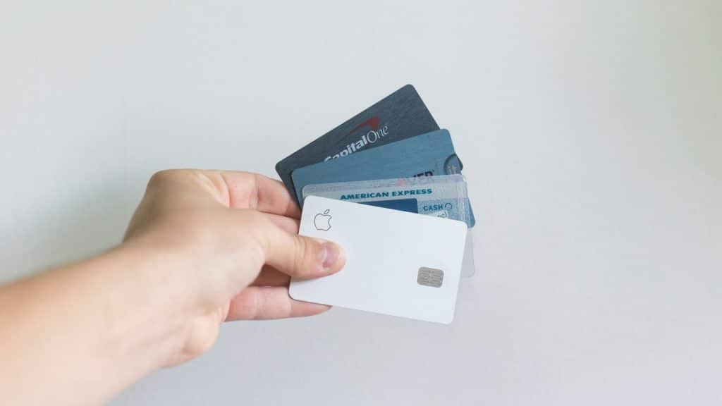 A person holding credit cards