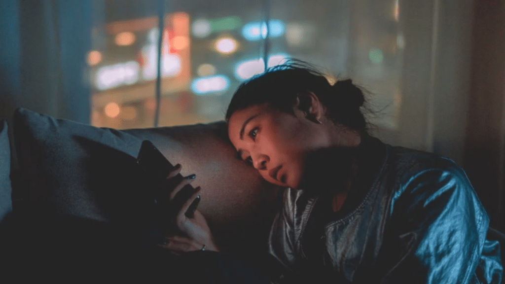 A woman looking sad at night
