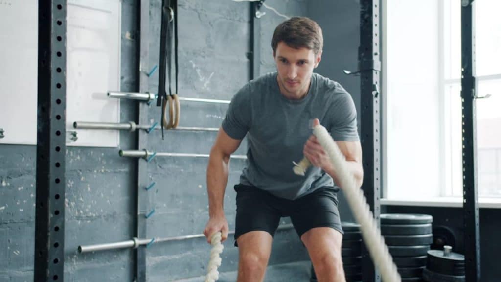Man working out at a gym with focus