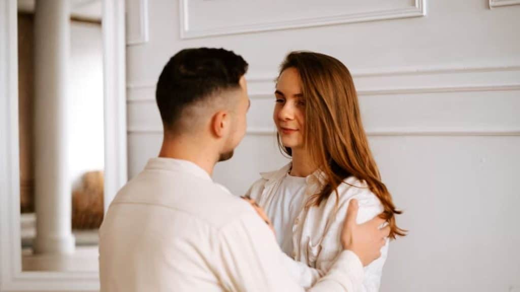 Man hugging wife after conversation