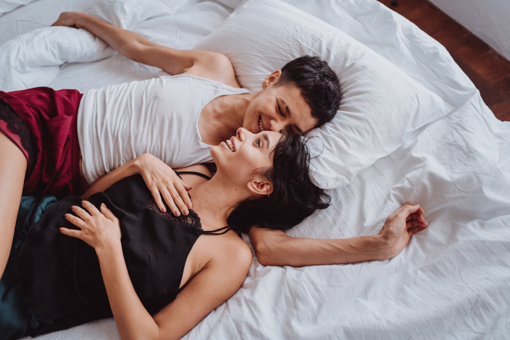 A couple cuddling on the bed