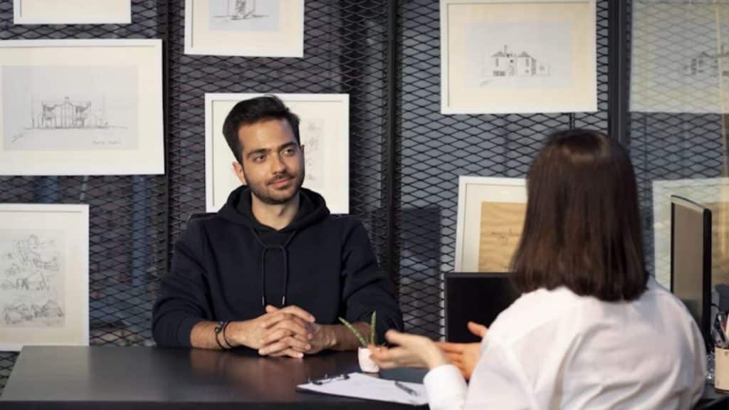 A man talking to a therapist in a calm, professional office setting