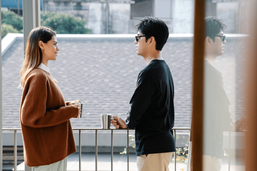A couple talking in the balcony