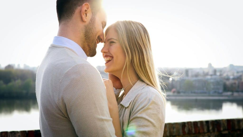 A couple looking in love at sunset