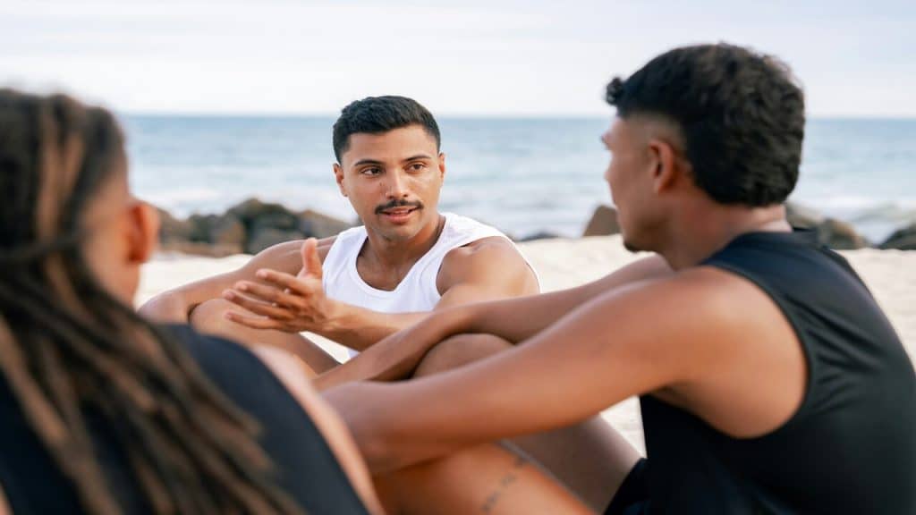 Friends talking at the beach