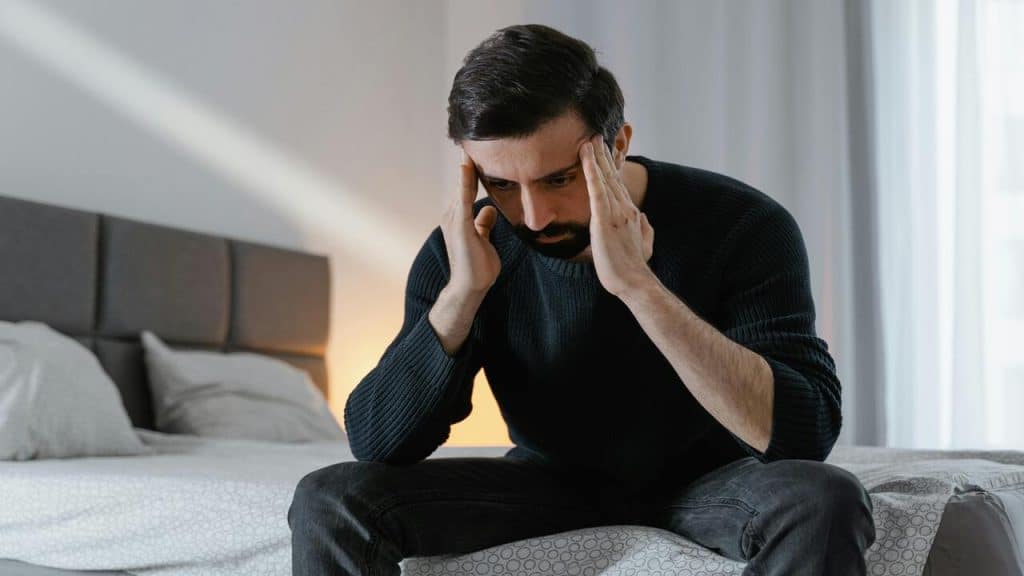 A man looking sad at home