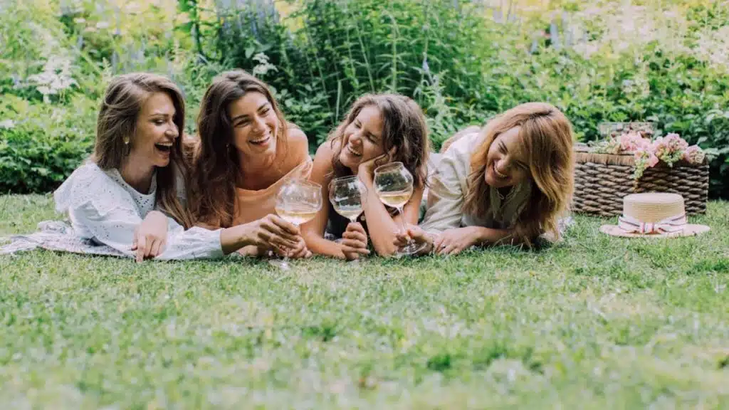 A woman laughing and feeling more happy with friends than her husband