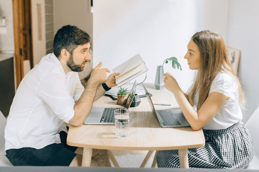 A couple discussing at a table