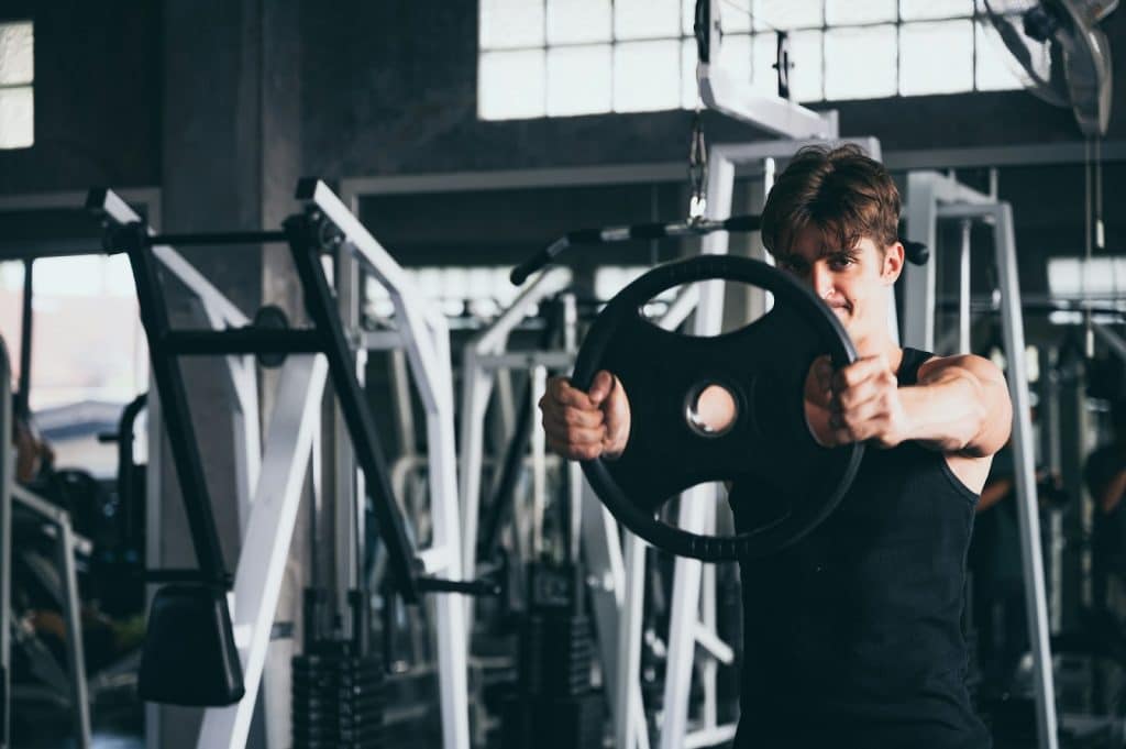 The man is working out in the gym.